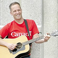 Independent Toronto musician Gregg Lawless with acoustic guitar. (Photo credit: Mike Barrett)